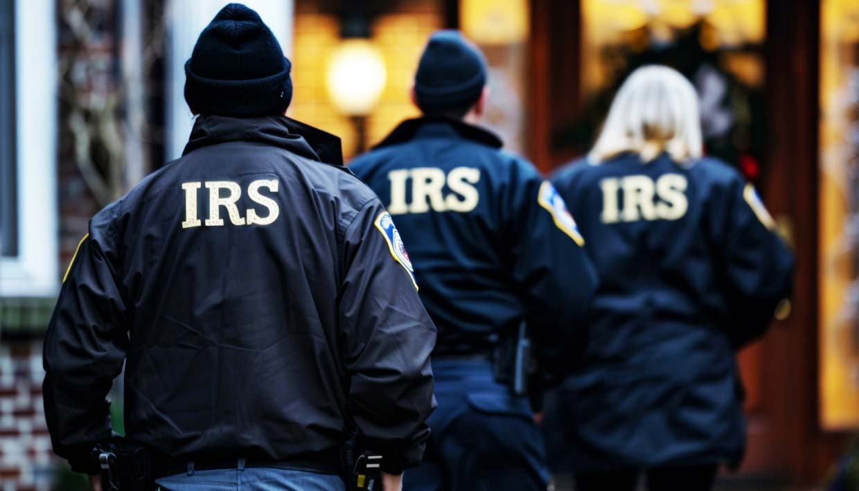 IRS tax agents standing in front of a mansion during a raid related to the largest federal criminal tax fraud case